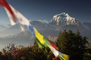 Crédence de cuisine en verre imprimé Dhaulagiri Bhuddism flags with Dhaulagiri peak in background at sunset in Himalaya Mountain, Nepal.