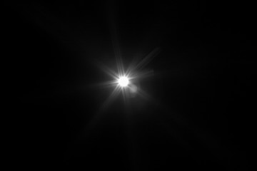 White light flare special effect in dark black.