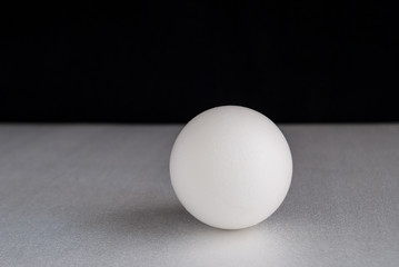egg on a gray and black background