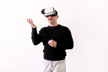 Handsome man wearing and playing virtual reality on isolated white background. Boy action in virtual reality helmet. VR glasses. VR Box, VR headset. Young business man at office and using Vr Box.