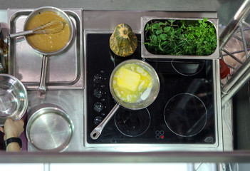 Preparing dinner on an induction hob in a home kitchen