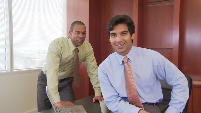 Portrait of two executives in conference room