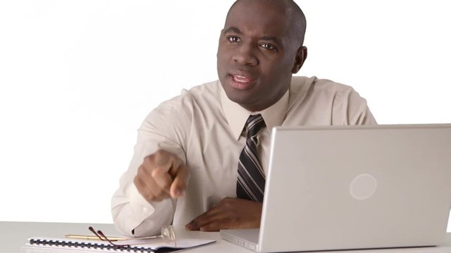 Angry African American business manager shouting at someone off screen