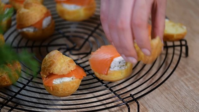 Salmon and creamcheese puffs. Profiteroles or canape