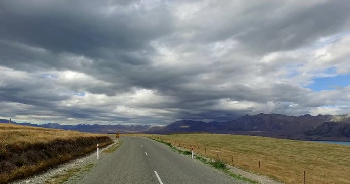NEW ZEALAND – MARCH 2016 : Video shot of driving through Mount Cook National Park on a beautiful day with road in view
