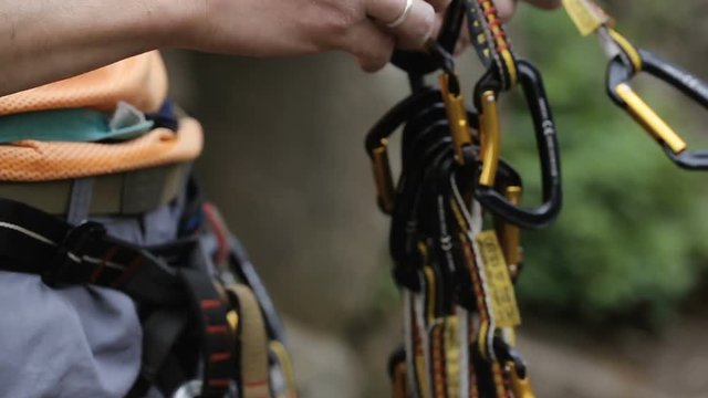 Closeup Shot of Rock climber clings carbines