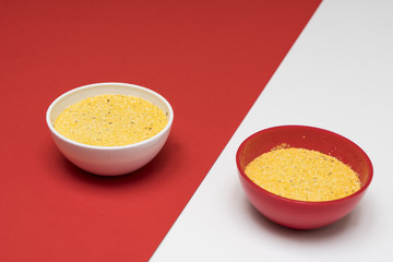 cornmeal a bowl on a colored background	