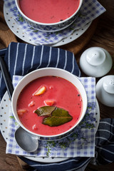Vegetarian red soup - borsch in green bowl.