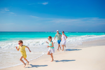 Happy family on beach vacation have a lot of fun
