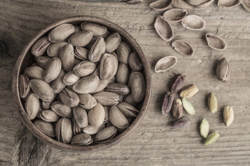 Some pistachios on wooden table