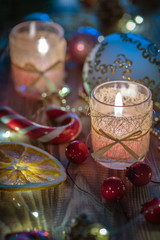 Close view Couple of Magic Christmas decorated Burning candles on wooden rustic background 3
