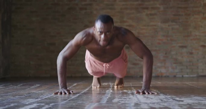  00:14 | 00:17 1&times;  A muscular and sweaty man is training at the gym by lifting the gym weights to strengthen his muscles. Concept of: workout, workout, power, supplements, fitness