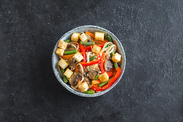 Stir fry with udon noodles, tofu and vegetables