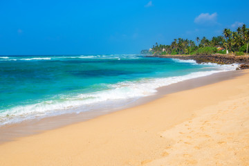 Fototapeta na wymiar Sunny day on tropical beach