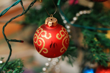 One red Christmas ball on christmas tree
