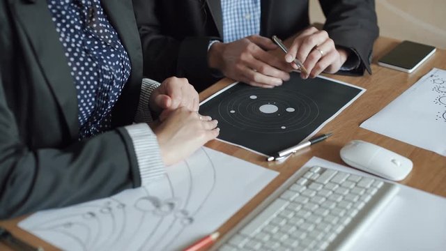 A team of engineers discussing a flight into space