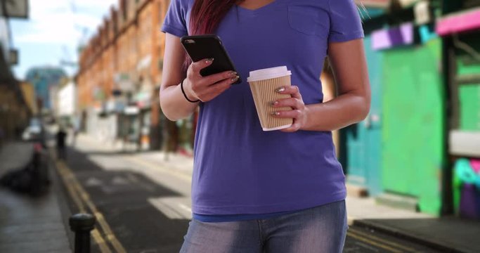 Japanese Female Texting On Mobile Phone In Artsy Neighborhood