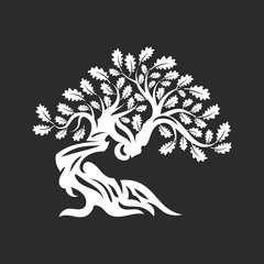 Huge and sacred oak tree silhouette logo badge isolated on dark background.