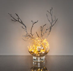 Christmas decoration with fairy lights in the glass vase