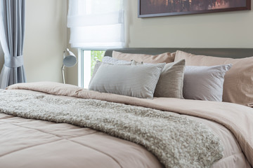 set of pillows on king bed size in luxury bedroom