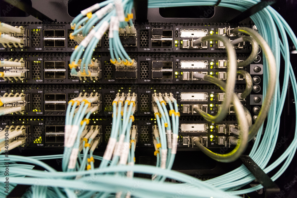 Aufkleber severs computer in a rack at the large data center. rack mounted servers. the image has a little noi