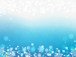 Illustration of Christmas background with blue and white snowflakes and bokeh