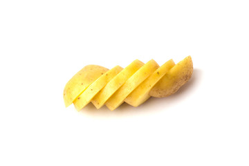 Sliced raw potatoes. Slices of chopped potatoes close-up on a white background.