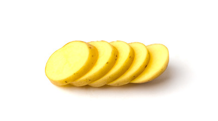 Sliced raw potatoes. Slices of chopped potatoes close-up on a white background.