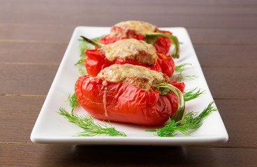 Pepper stuffed with meat. Baked Bulgarian pepper with minced meat and rice and cheese.