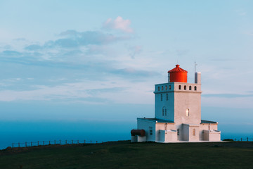 Fototapeta na wymiar White lighthouse at Cape Dyrholaey, Iceland. Landscape photography