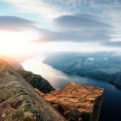 Colourful sunrise on Preikestolen (pulpit-rock) - famous tourist attraction in the municipality of...