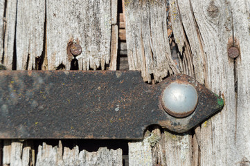 iron on old wooden gate