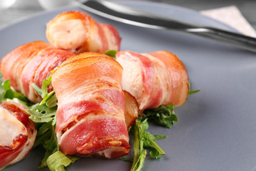 Plate with bacon wrapped chicken nuggets, closeup