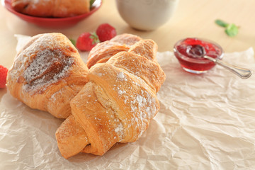Tasty croissants on table, closeup