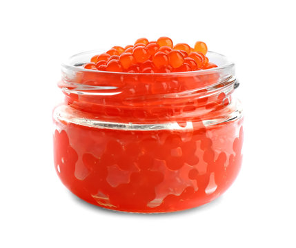 Delicious red caviar in glass jar on white background