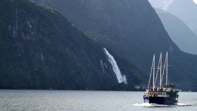 NEW ZEALAND &ndash; MARCH 2016 : Video shot of Milford Sound fiord from a boat with mountains and boat in view