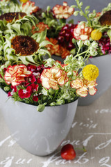 Obraz na płótnie Canvas Floral arrangement with carnations and craspedias.