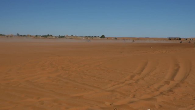 Four wheel drives in the Sahara, traditional entertainment for tourists in Moroccan desert  4K
