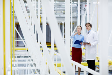 Engineers of mining farm having discussion of new technologies at working meeting