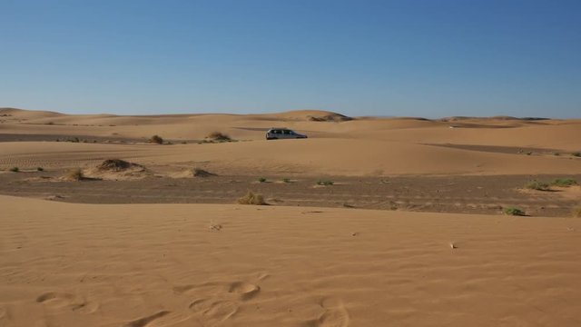Four wheel drives in the Sahara, traditional entertainment for tourists in Moroccan desert  4K