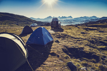 Tent camp adventure in Norwegian landscape highlands vintage filter