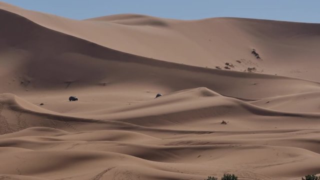 Four wheel drives in the Sahara, traditional entertainment for tourists in Moroccan desert  4K