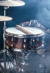 musical instruments drum kit, flash of light, a beautiful light in the background with copy space