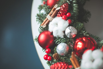 Christmas Background with Xmas Evergreen Twig, Red Glass Balls and New Year Decorations