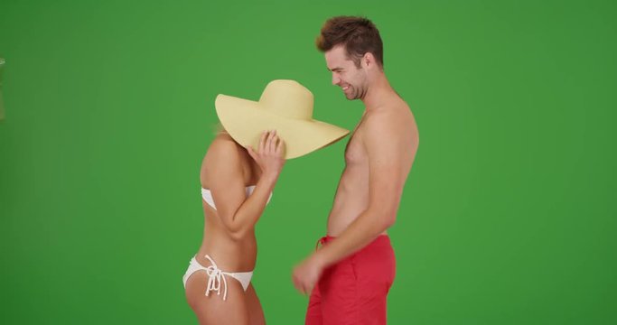 White millennial couple enjoying their vacation on green screen. On green screen to be keyed or composited. 