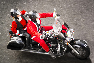 santa claus on motorbike in city street
