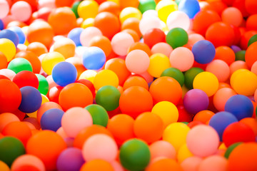 Colourful plastic balls pool background.