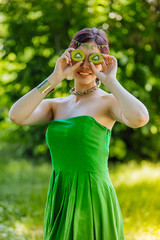 Beautiful young asian woman with kiwi