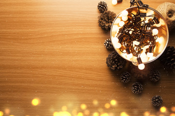 paty light bulb with bucket and wood pine cone in christmas concept