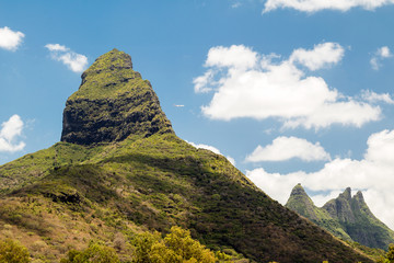Fototapeta na wymiar Piton de la Petite Riviere mountain. It is the highest mountain on the island of Mauritius, in the Indian Ocean. Located in the district of Río Negro and rising to a height of 828 m above sea level